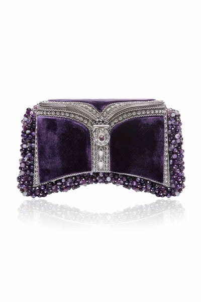 SHOP Mae Cassidy - Only 1 of 100 pieces made as part of our AW20, Limited Edition ‘In The Stars’ Collection. The Zeenat Gemstone Clutch Bag; handmade from silver-tone metalwork, scores of shimmering crystals and over 1200 semi-precious, Balancing Chevron Amethyst gemstones, each individually threaded onto intricate silver-tone metal pins. Contrasted by deep violet purple, plush velvet panels. 