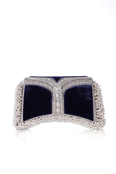 The Zeenat Pearl Purse Clutch Bag in Midnight Navy Blue & Silver, from Mae Cassidy Capsule Collection An Evening In Paris. Each piece is handmade by a skilled artisan from recyclable silver-tone metalwork in a structured curved shape and Midnight Navy Blue silk velvet panels. Embellished with shimmering crystals & over 1200 pearl detailing. Style it hand held or cross-body with it's detachable chain. It's the clutch you’ll always turn too to up the ante on any outfit.