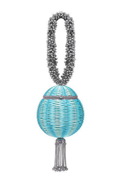SHOP The Babi Beach Bracelet Clutch Bag from Mae Cassidy's SS21 'Poolside Glamour Collection'; https://maecassidy.com/ It’s playful hand woven aqua mint turquoise blue detailing, reminisce a nostalgia for the 1950’s picnic style. Each piece is handmade by a skilled artisan from recyclable silver tone metalwork in a structured circular shape with bell detailing and a swishy chain tassel. Photography: Annie Lai, Set: Laura Little, MUA: Jinny Kim, Styling: Rubina Marchiori, Direction: Georgina Mae Lindsay