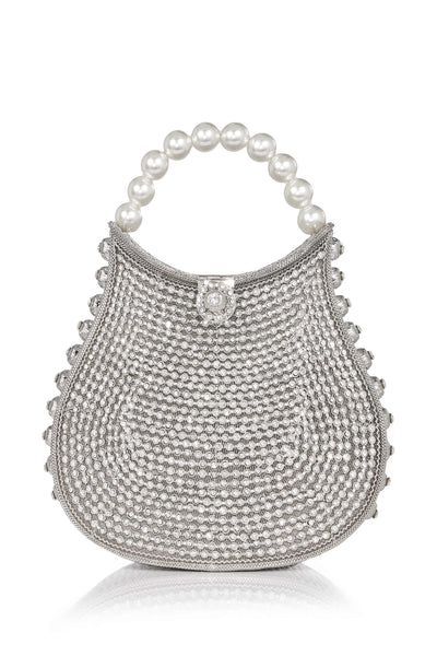 The Mae Cassidy Silver Nimmi Crystal Pearl Purse Handbag, from our New In "All That Glitters" collection. It's the only accessory you'll need to dazzle after dark.   Embellished with over 2000 hand-placed, light catching sparkling crystals and oh-so-pretty pearl detailing. Slide your arm through it's elegant pearl top handle, to keep you hands free to step into cocktail hour. 