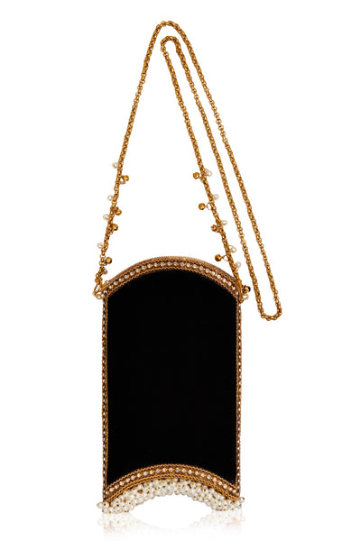 Mae Cassidy The Velvet Pearl Phone Bag in Cocktail Black and Gold, from Mae Cassidy's Capsule Collection An Evening In Paris. Style cross-body or over shoulder. It's the perfect size to fit all Iphone Plus styles, a small cardholder, keys, lipstick, and other small essentials. Each piece is handmade by a skilled artisan from recyclable gold-tone metalwork in a structured curved shape with black velvet panels. Embellished with shimmering crystals over 200 pearl detailing & handmade chain.