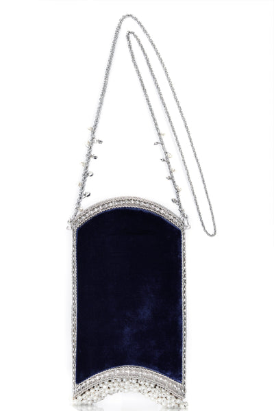 The Velvet Pearl Phone Bag in Midnight Navy Blue and Silver, from Mae Cassidy Capsule Collection An Evening In Paris. Style cross-body or over shoulder. It's the perfect size to fit all Iphone Plus styles, a small cardholder, keys, lipstick, and other small essentials. Each piece is handmade by a skilled artisan from recyclable silver-tone metalwork in a structured curved shape with  Midnight Navy Blue velvet panels. Embellished with shimmering crystals over 200 pearl detailing & handmade chain.
