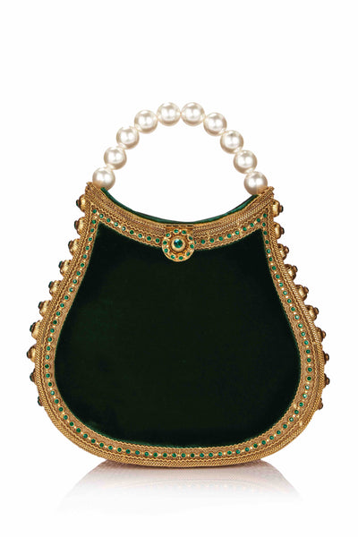 Introducing the ultimate bejewelled party piece; The Mae Cassidy, Nimmi Jewel Emerald and Gold handbag. Guaranteed to become the gem of your wardrobe. Embellished with hand-placed, light catching sparkling emerald crystals and oh-so-pretty handle. Contrasted by plush emerald green Velvet plush panels. Slide your arm through it's elegant pearl top handle, to keep you hands free to step into cocktail hour. 