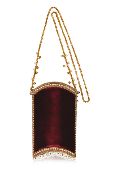 Our favourite Mae Cassidy style is back this season in a sumptuous Ruby Red; Velvet Pearl Phone Bag Style.  Designed with a casual twist on our classic Zeenat Pearl Purse. Style up or down, day-to-night, over shoulder or cross-body with jeans and a jacket or a dress and trainers combo - for an effortlessly cool twist on any look.  "As beautiful as a piece of jewellery"; you won't need any other accessory.