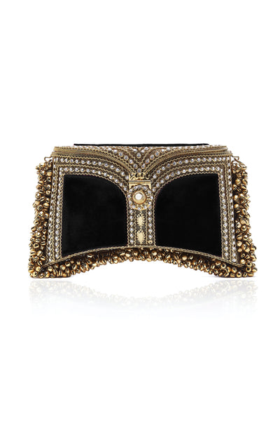 The Zeenat Pearl Clutch Bag in Cocktail Black and Gold. from Mae Cassidy Capsule Collection An Evening In Paris. Each piece is handmade by a skilled artisan from recyclable gold-tone metalwork in a structured curved shape and cocktail black silk velvet panels. Embellished with shimmering crystals & bell detailing. Style it hand held or cross-body with it's detachable chain. It's the clutch you’ll always turn too to up the ante on any outfit.