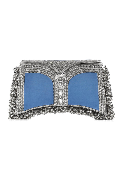 SHOP The Zeenat Clutch Bag, from Mae Cassidy SS21 Poolside Glamour Collection https://maecassidy.com/ It’s playful coastline denim blue silk coloured panels, reminisce a nostalgia for the 1950’s picnic style. Each piece is handmade by a skilled artisan from recyclable silver-tone metalwork in a structured curved shape with bell detailing and shimmering crystals. Photography: Annie Lai, Set: Laura Little, MUA: Jinny Kim, Styling: Rubina Marchiori, Direction: Georgina Mae Lindsay